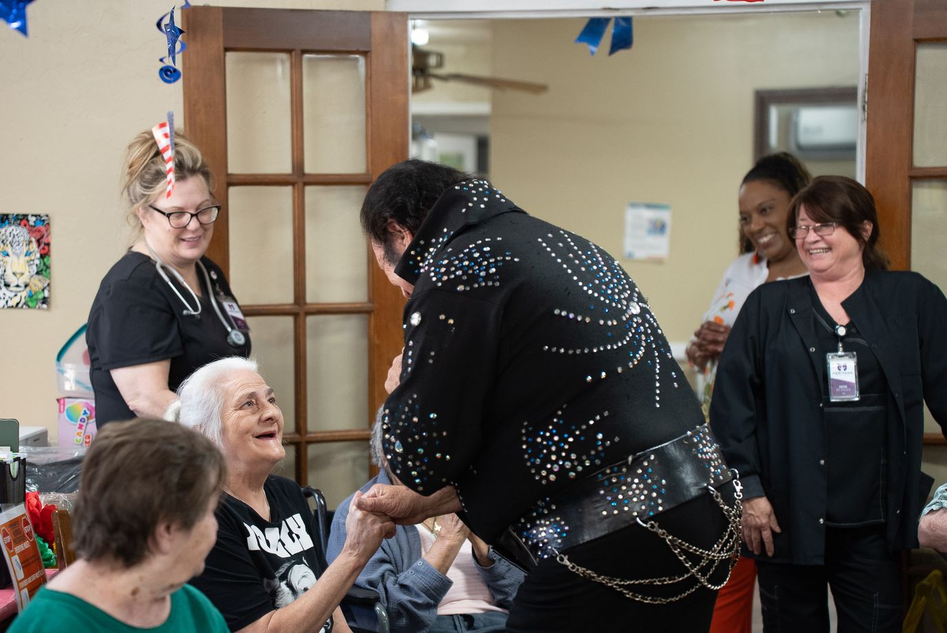 Residents enjoying a live performance in a common area