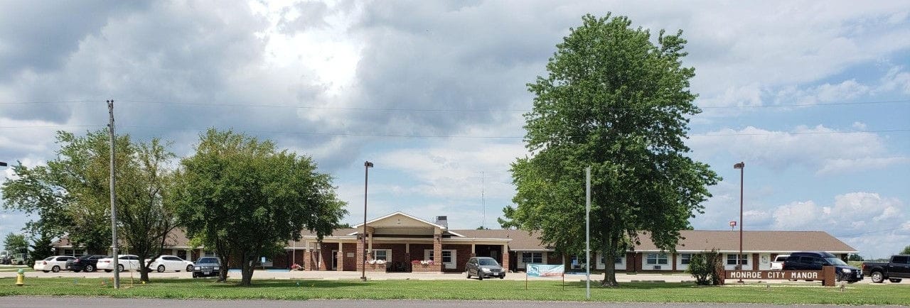 Exterior view of nursing home building with trees