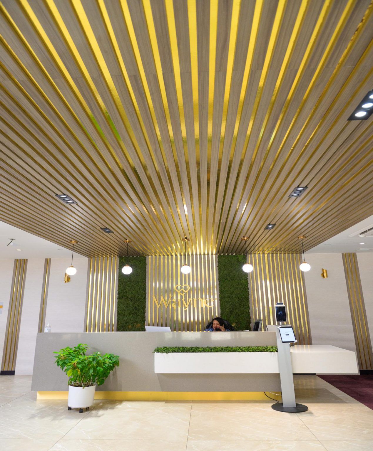 Modern reception area with indoor greenery and stylish decor