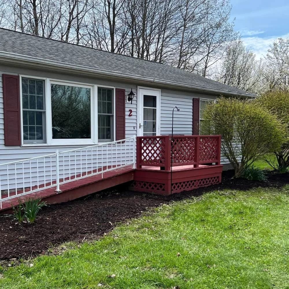Exterior view of a small house with a porch