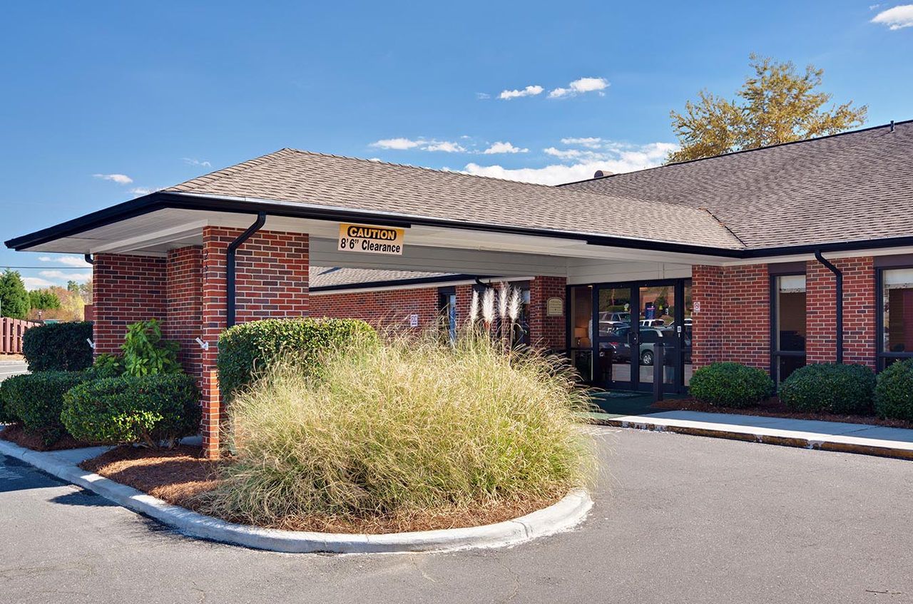 Entrance to a senior living facility with landscaping