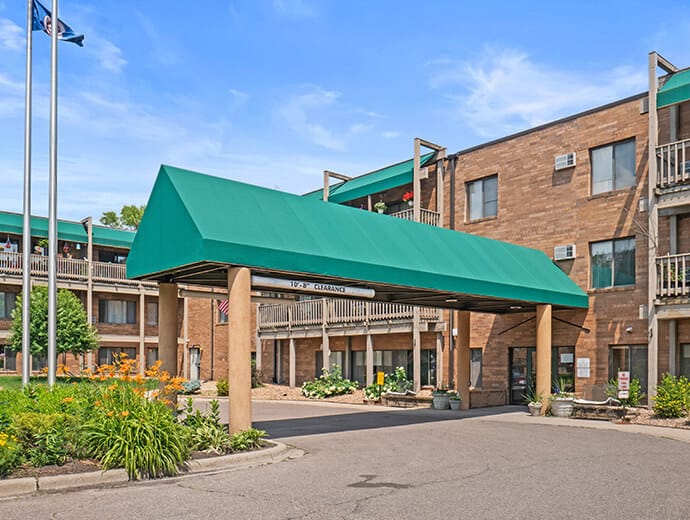 Exterior view of assisted living facility with green awning