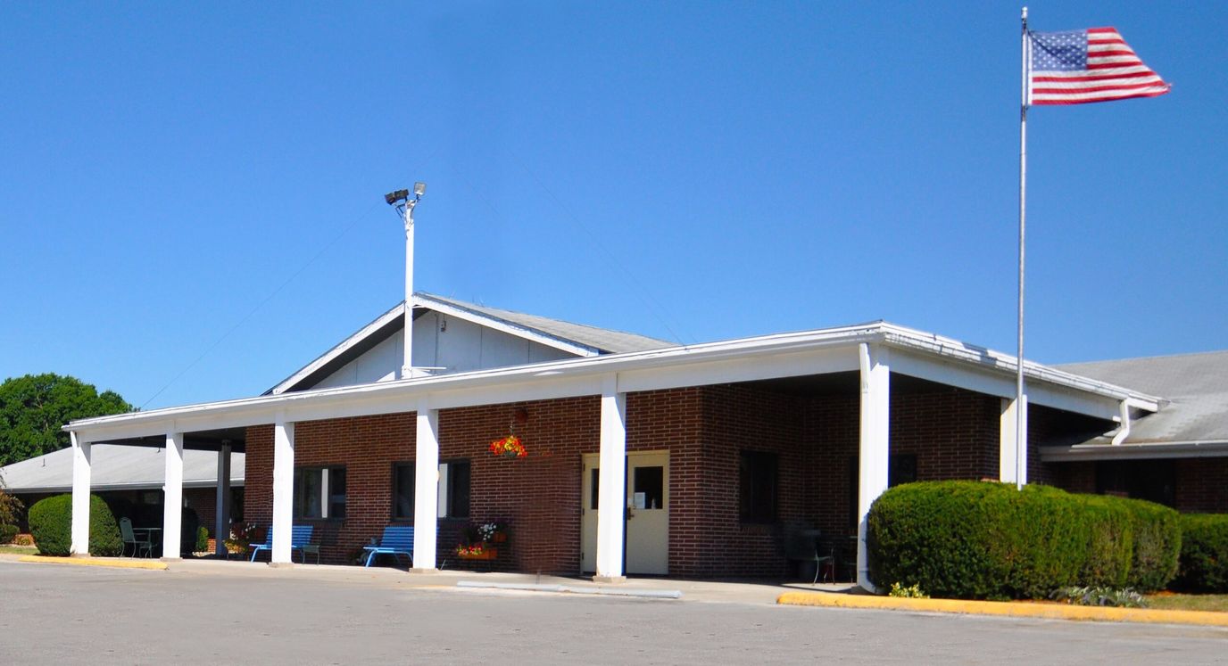Exterior view of the facility with American flag