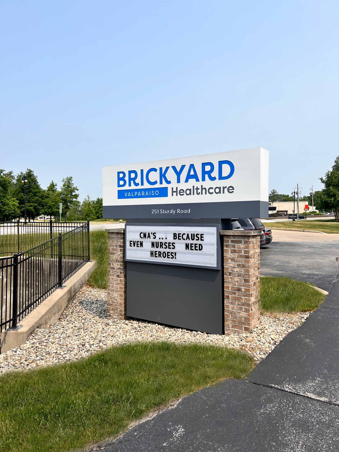 Facility sign outside with a message for nurses
