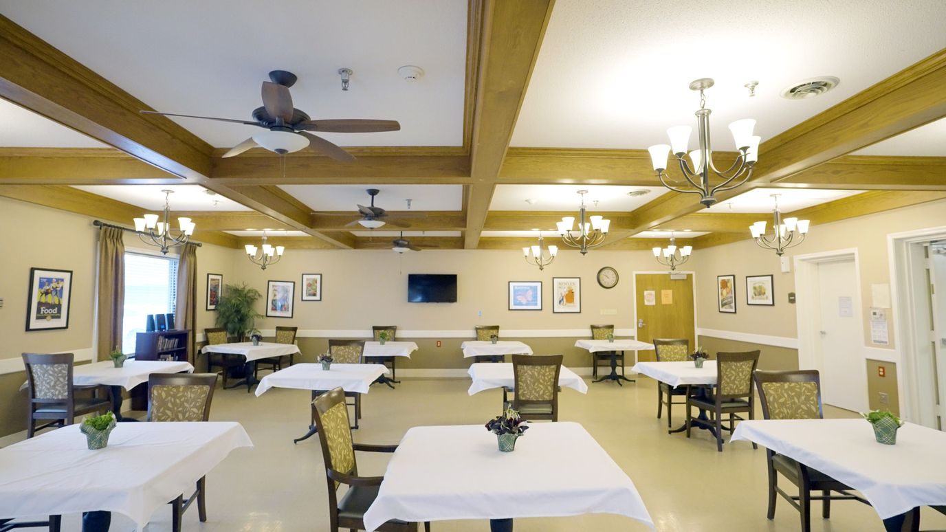 Interior view of a dining room with table settings