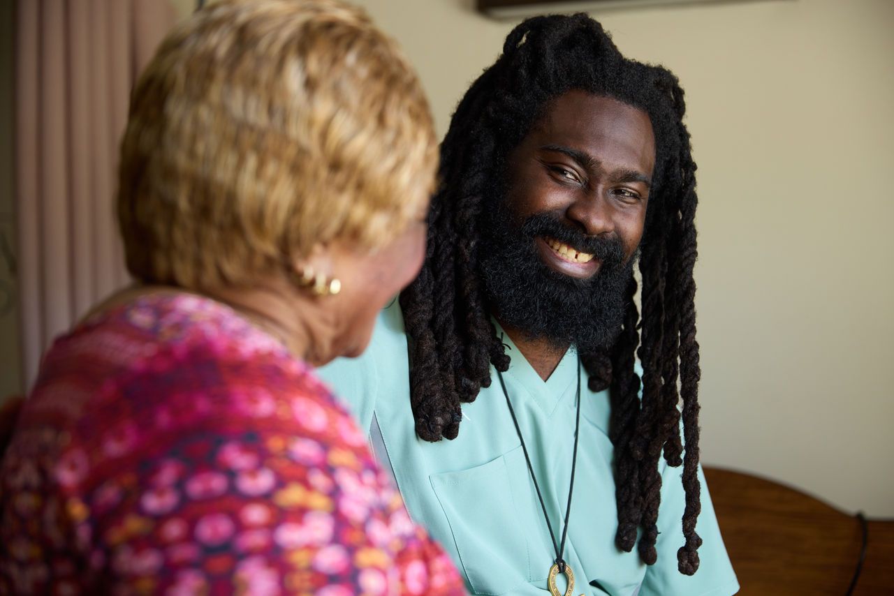 Caregiver and resident enjoying a conversation