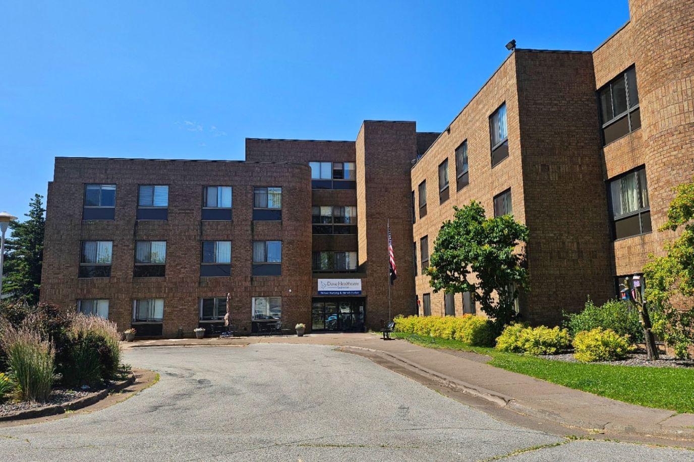 Exterior view of the facility building with landscaping