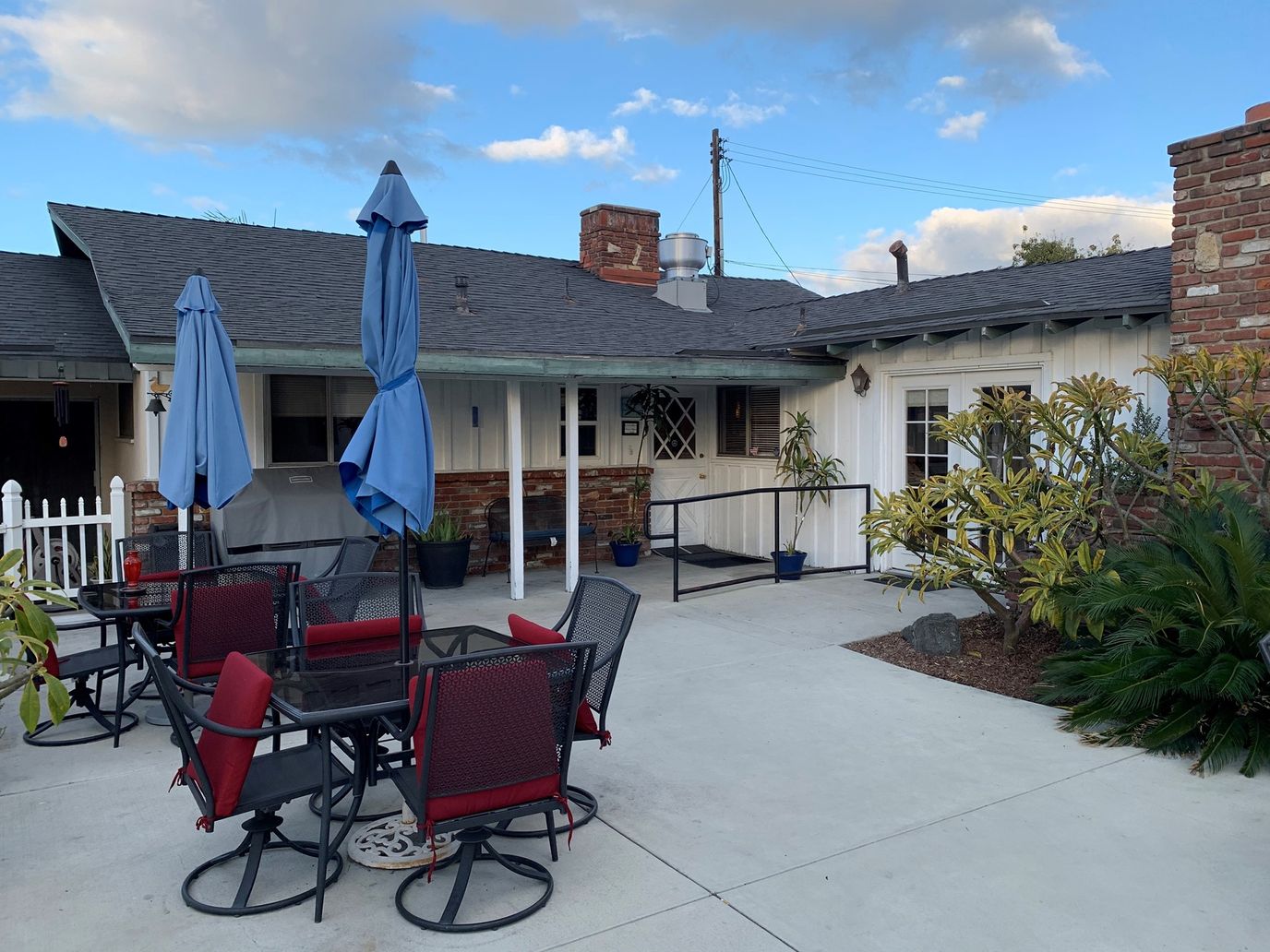 Outdoor seating area with tables and umbrellas