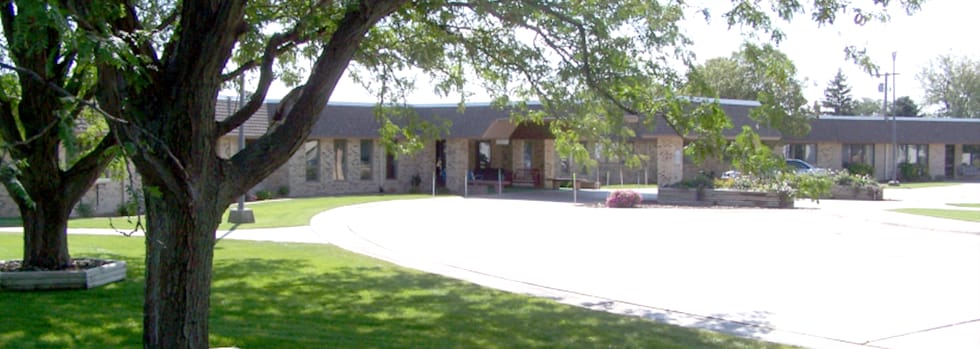 Exterior view of Bethel Home Inc surrounded by green space