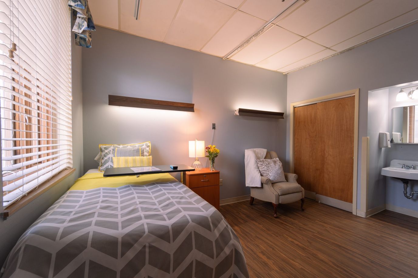 Private resident room with cozy furnishings and natural light
