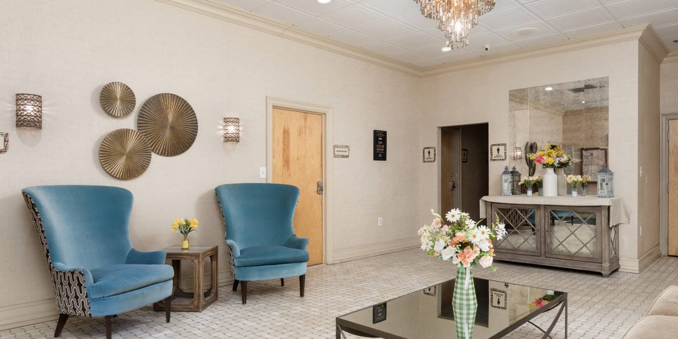 Bright and inviting lobby area with blue chairs
