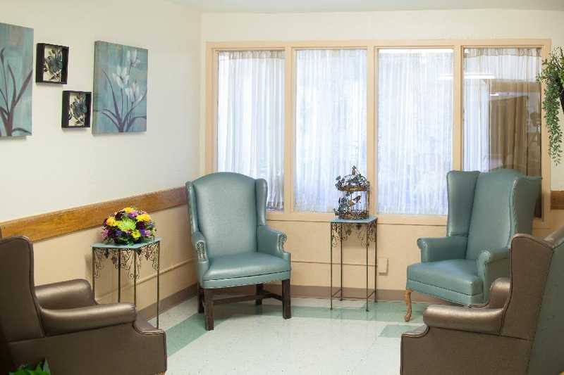 Cozy common area with chairs and floral decor