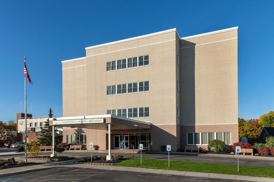 Exterior view of Elderwood facility with flag