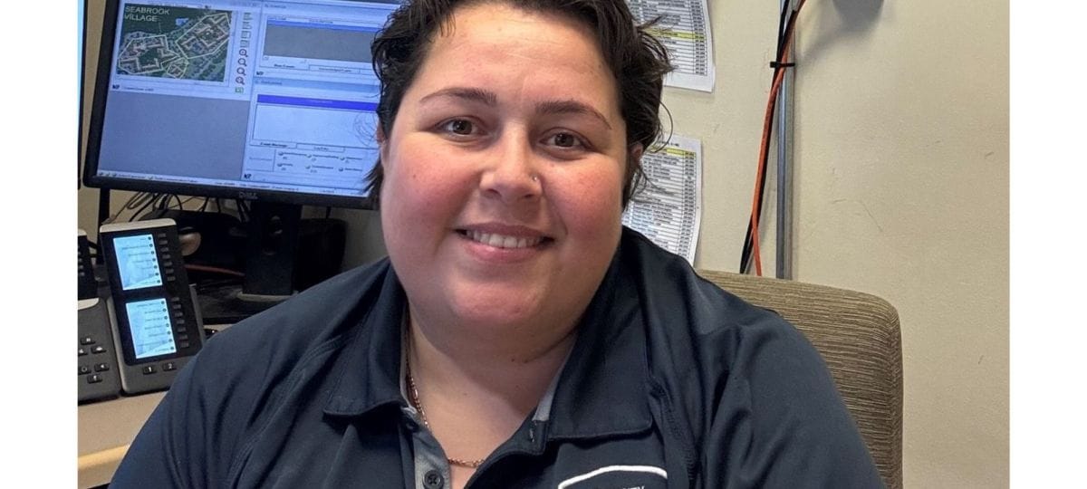 Staff member posing in an office setting