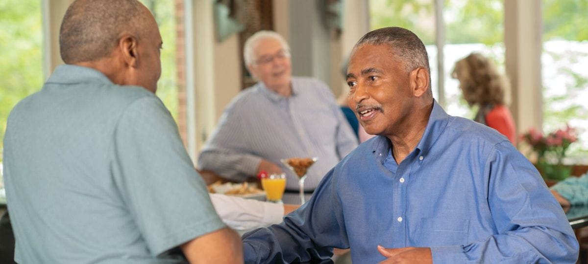 Residents engaging in conversation in a common area