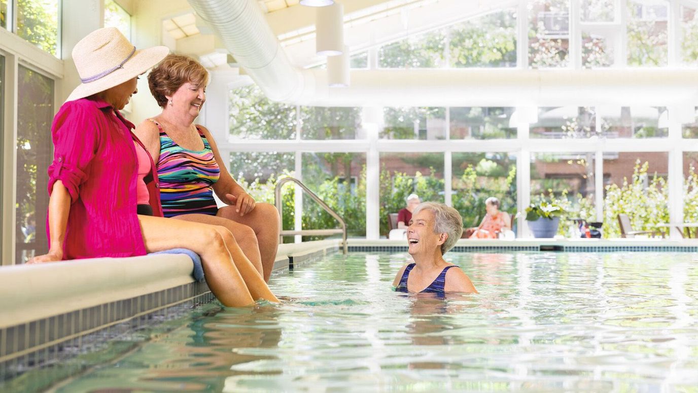 Residents enjoying a swim in an indoor pool