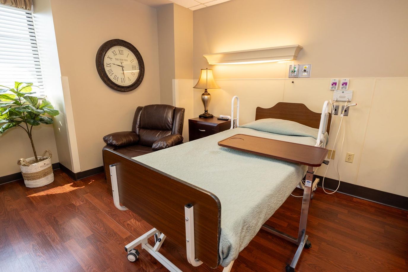 Private resident room with a bed and seating area