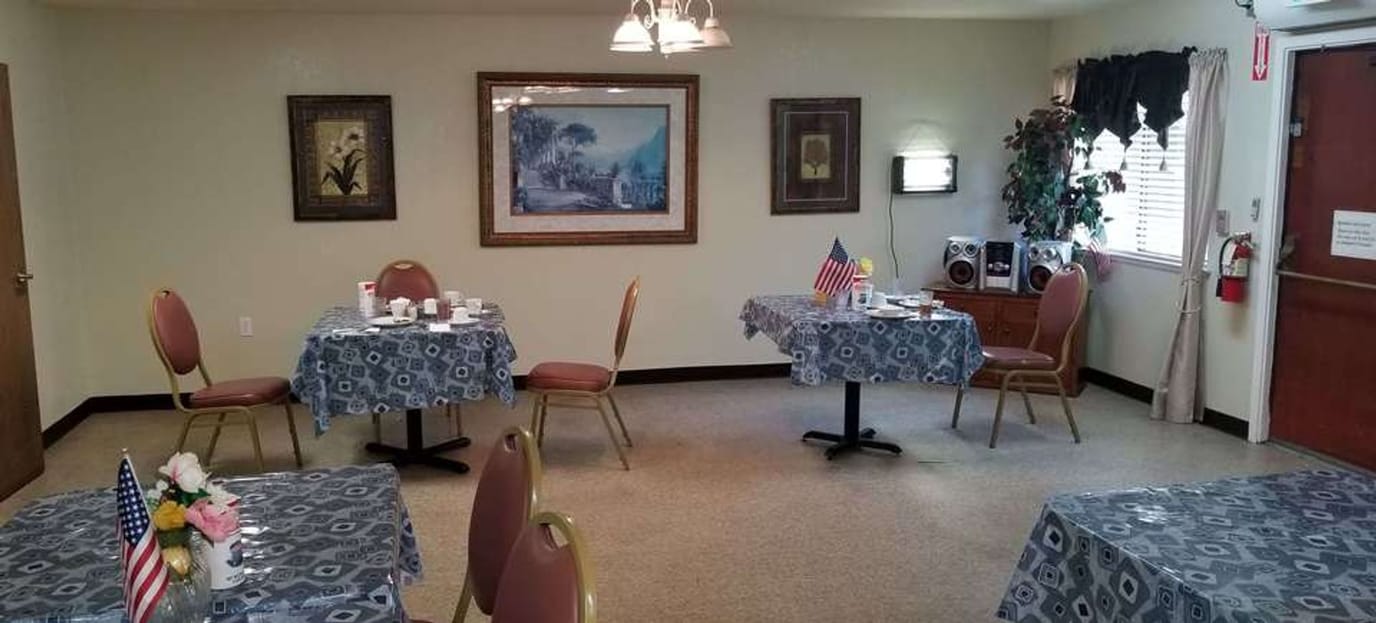 Dining area with tables set for residents