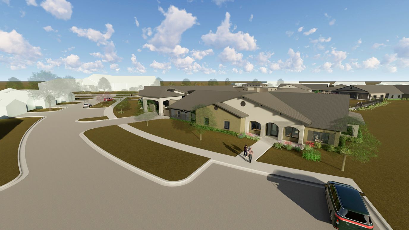 Aerial view of a senior living facility with landscaped pathways