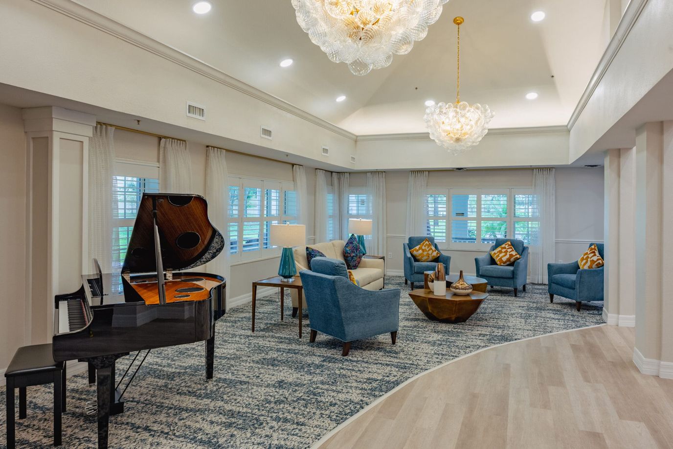 Bright lounge area with piano and comfortable seating
