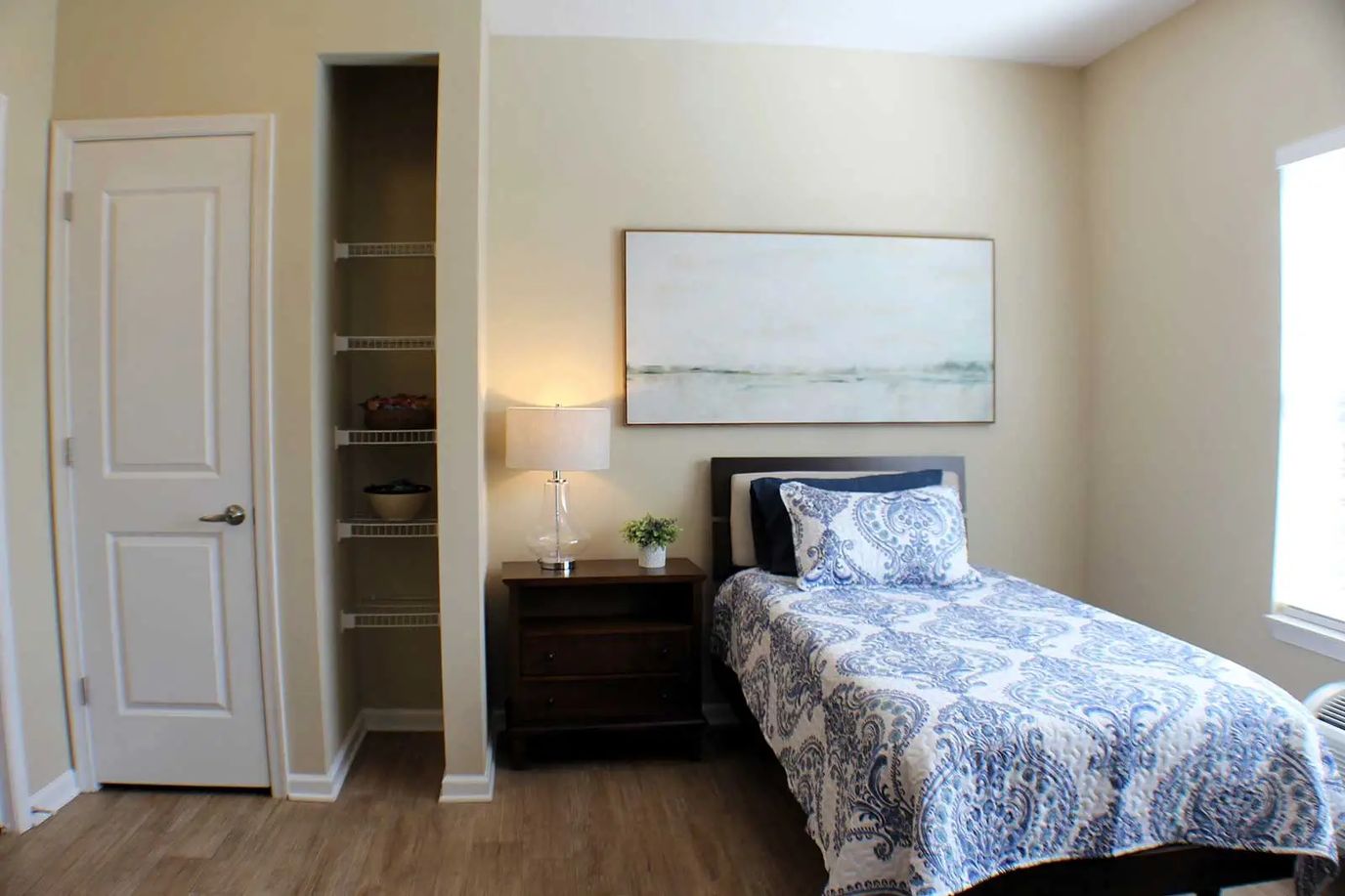 A cozy resident room with a bed and decor