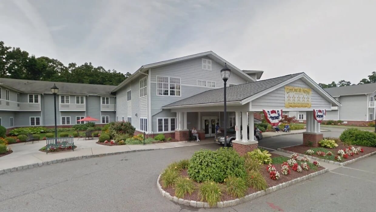 Exterior view of assisted living facility with landscaping