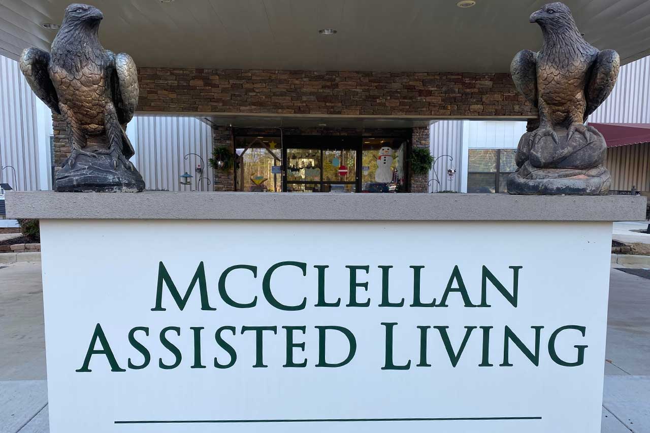 Sign of McClellan Assisted Living with eagle statues