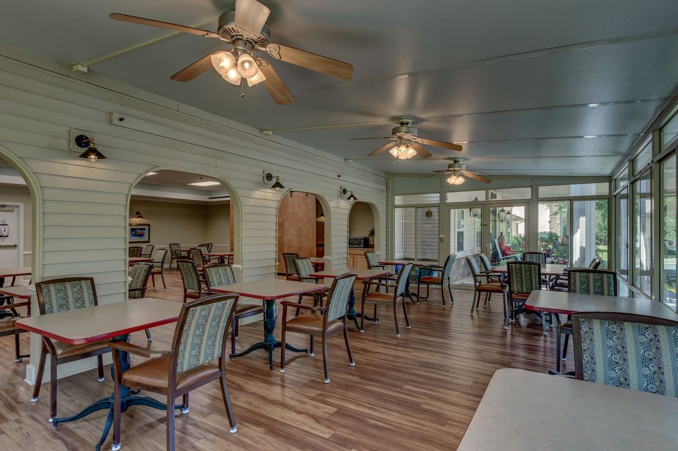 Bright dining area with tables and chairs
