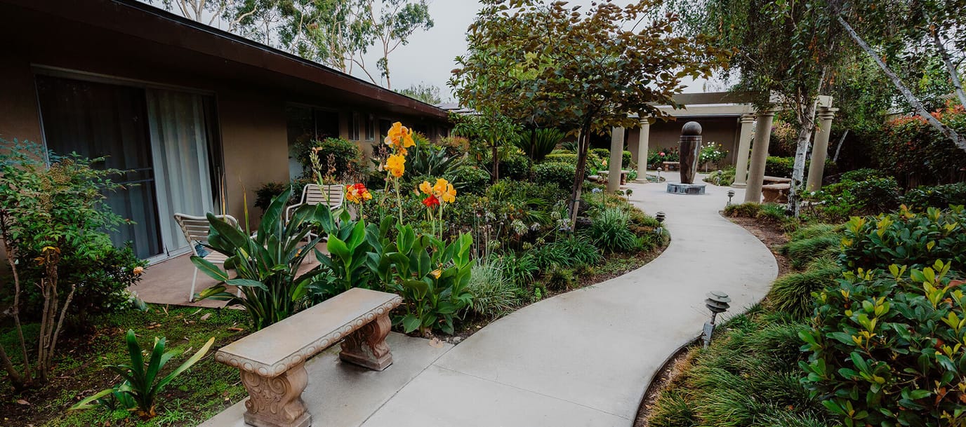 Pathway through a landscaped garden area at the facility