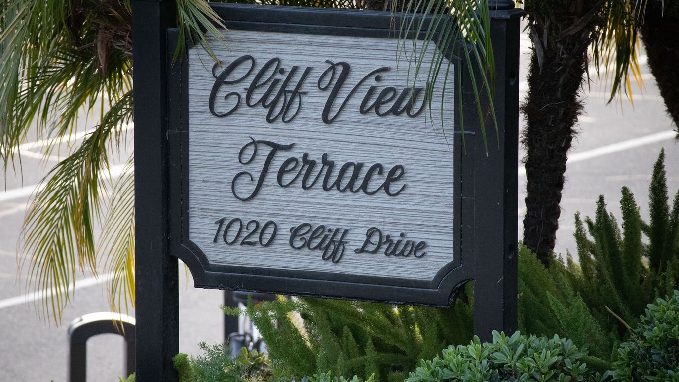 Sign for Cliff View Terrace with palm trees