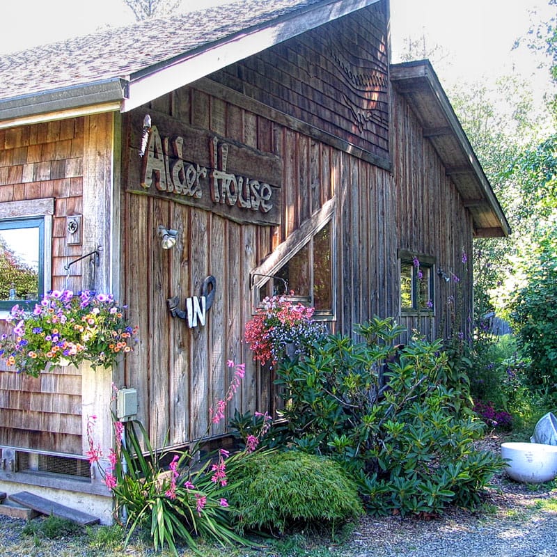 Exterior view of Alder House with flowers and greenery