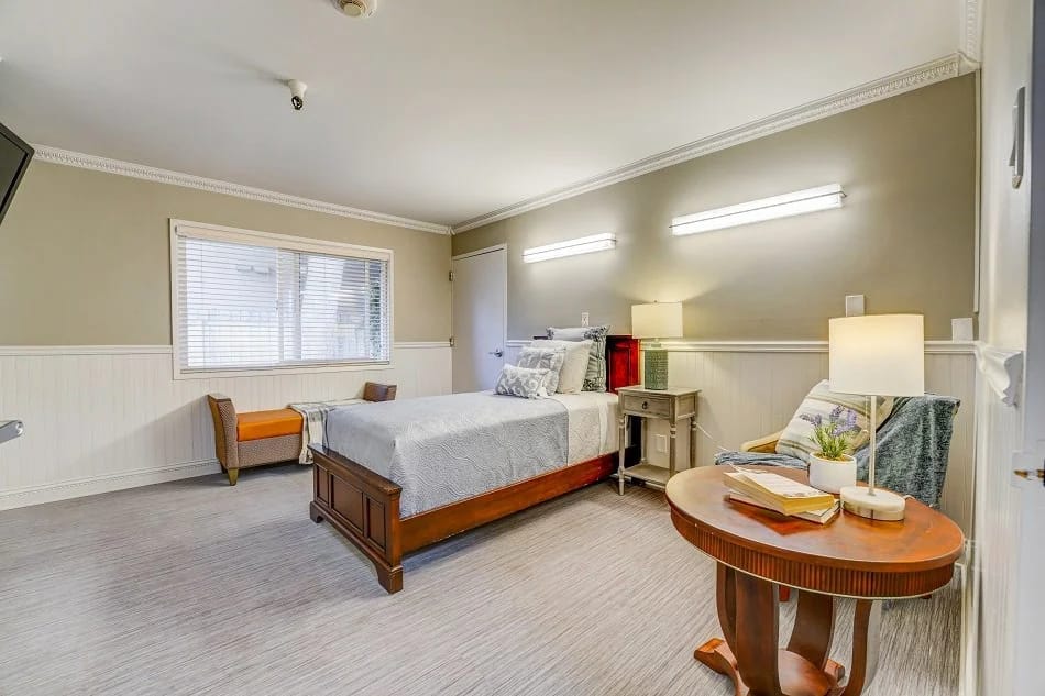 Cozy private resident room with a bed and decorative elements