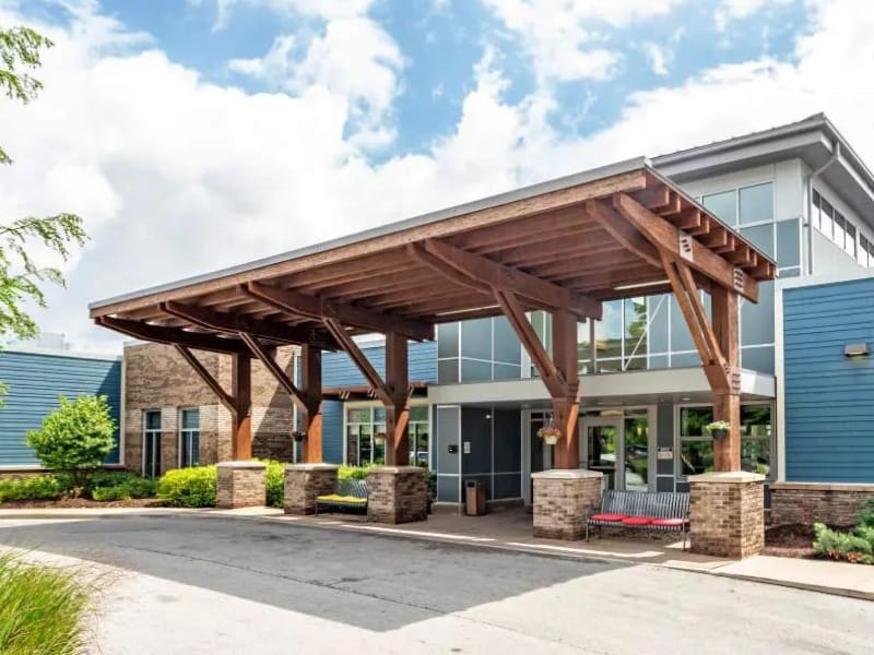 Entrance of a senior living facility with a covered entry