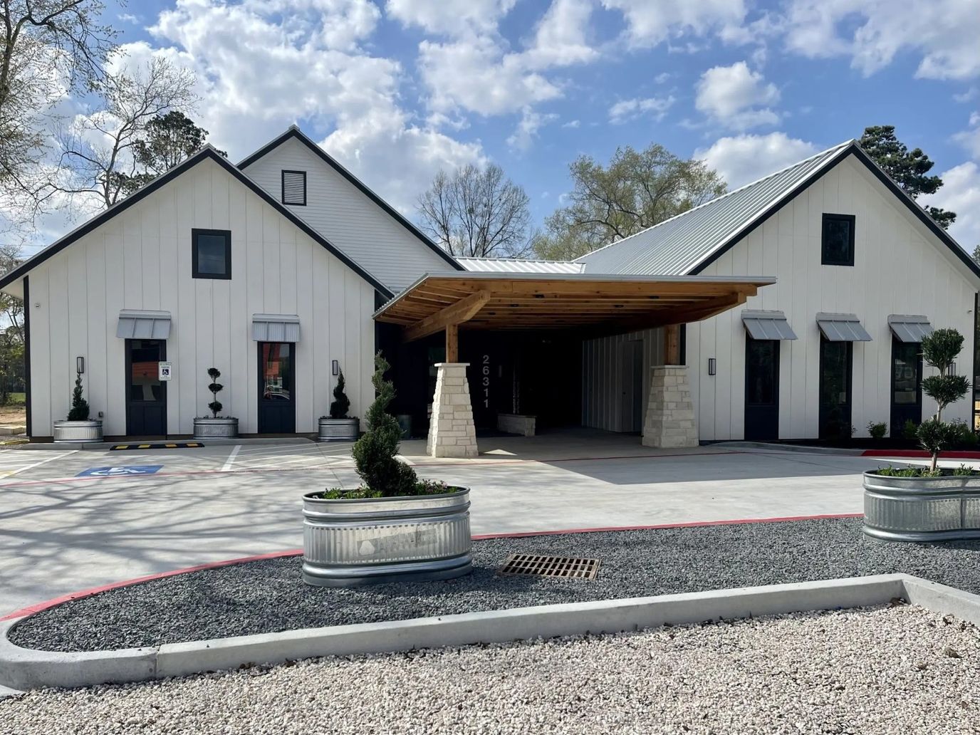 Exterior view of The Woodlands Memory Care facility