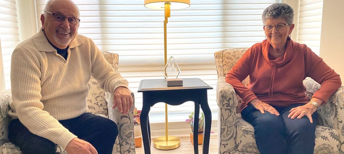 Two residents sitting in a cozy lounge
