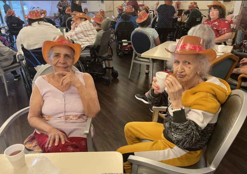 Residents enjoying a festive gathering in the common area