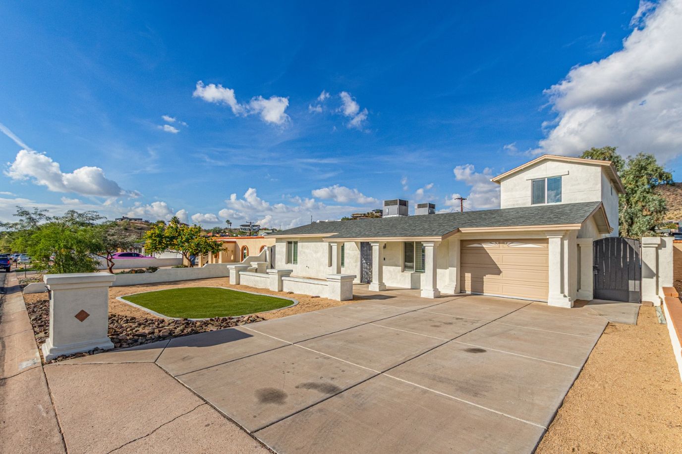 Exterior view of a senior living facility with landscaped front yard