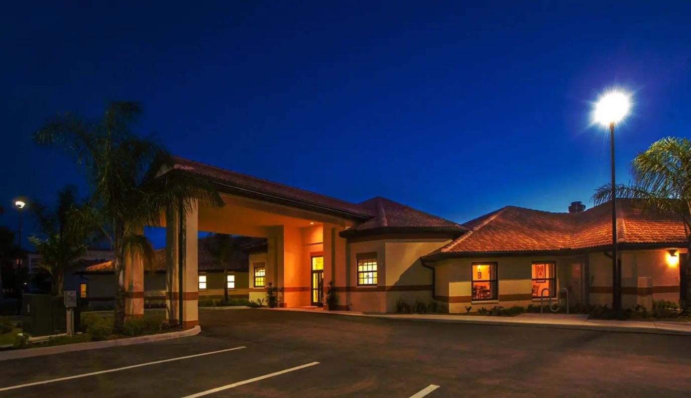 Building exterior of a senior living facility at night