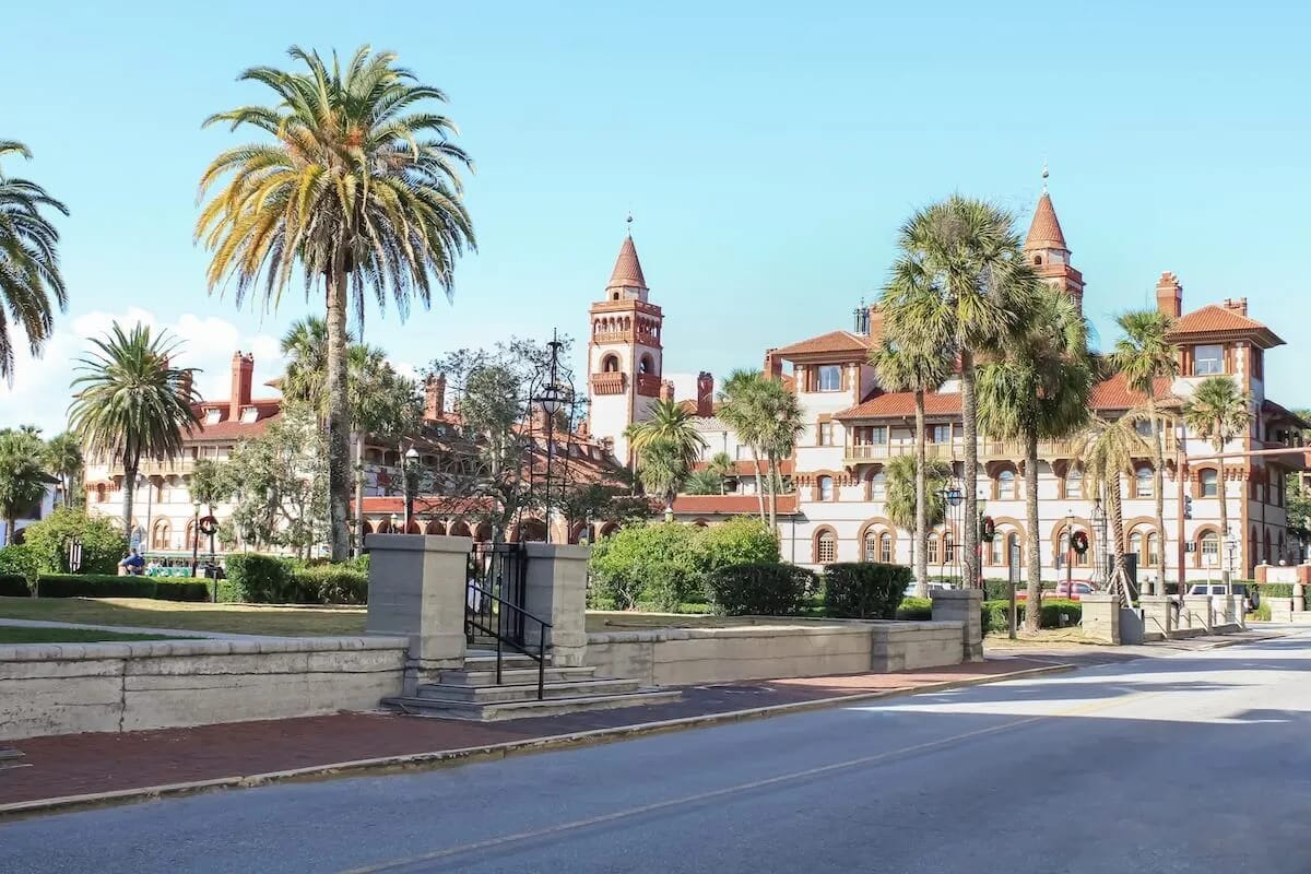 Exterior view of a senior living facility with palm trees