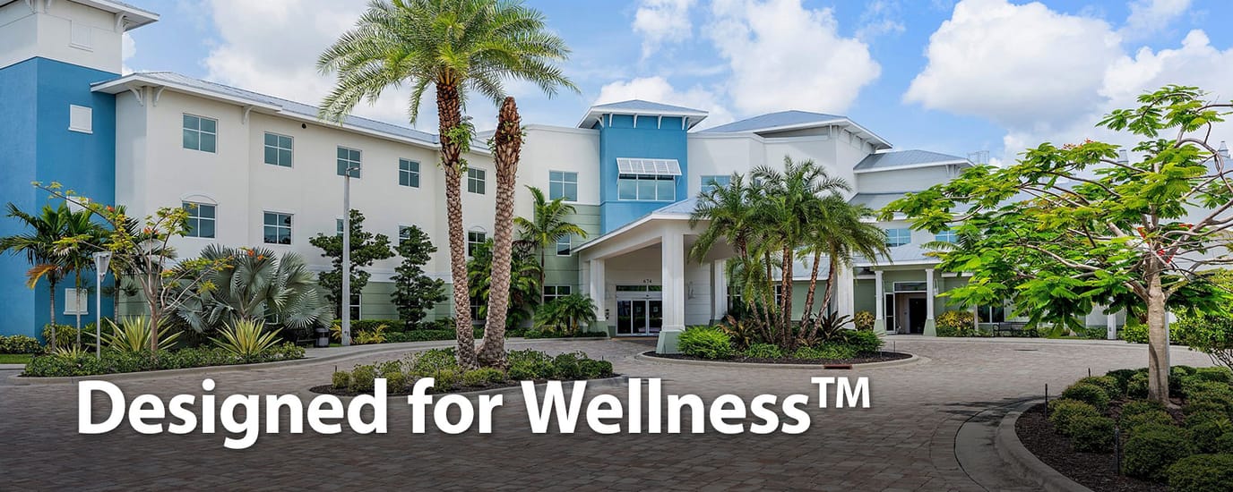 Exterior view of Luxe Senior Living at Jupiter with landscaping