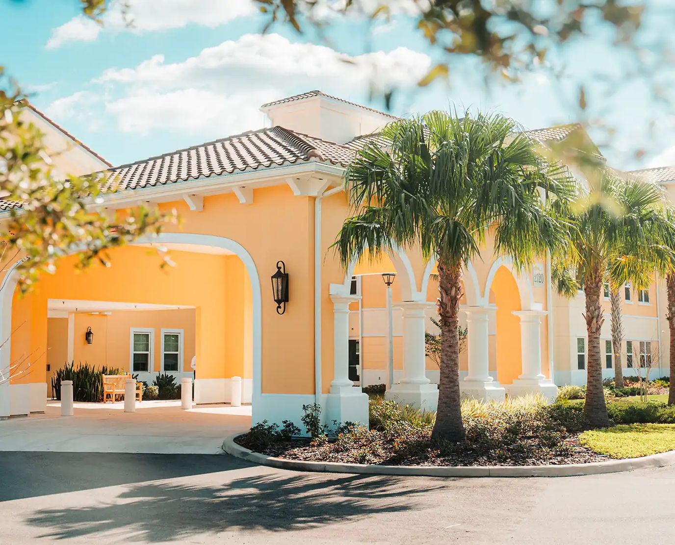 Exterior view of Legacy Pointe building with palm trees