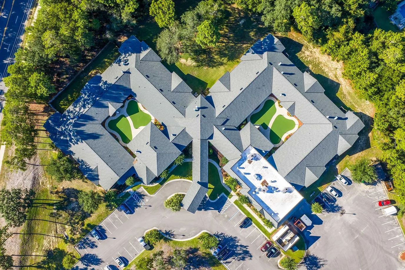 Aerial view of an assisted living facility surrounded by greenery
