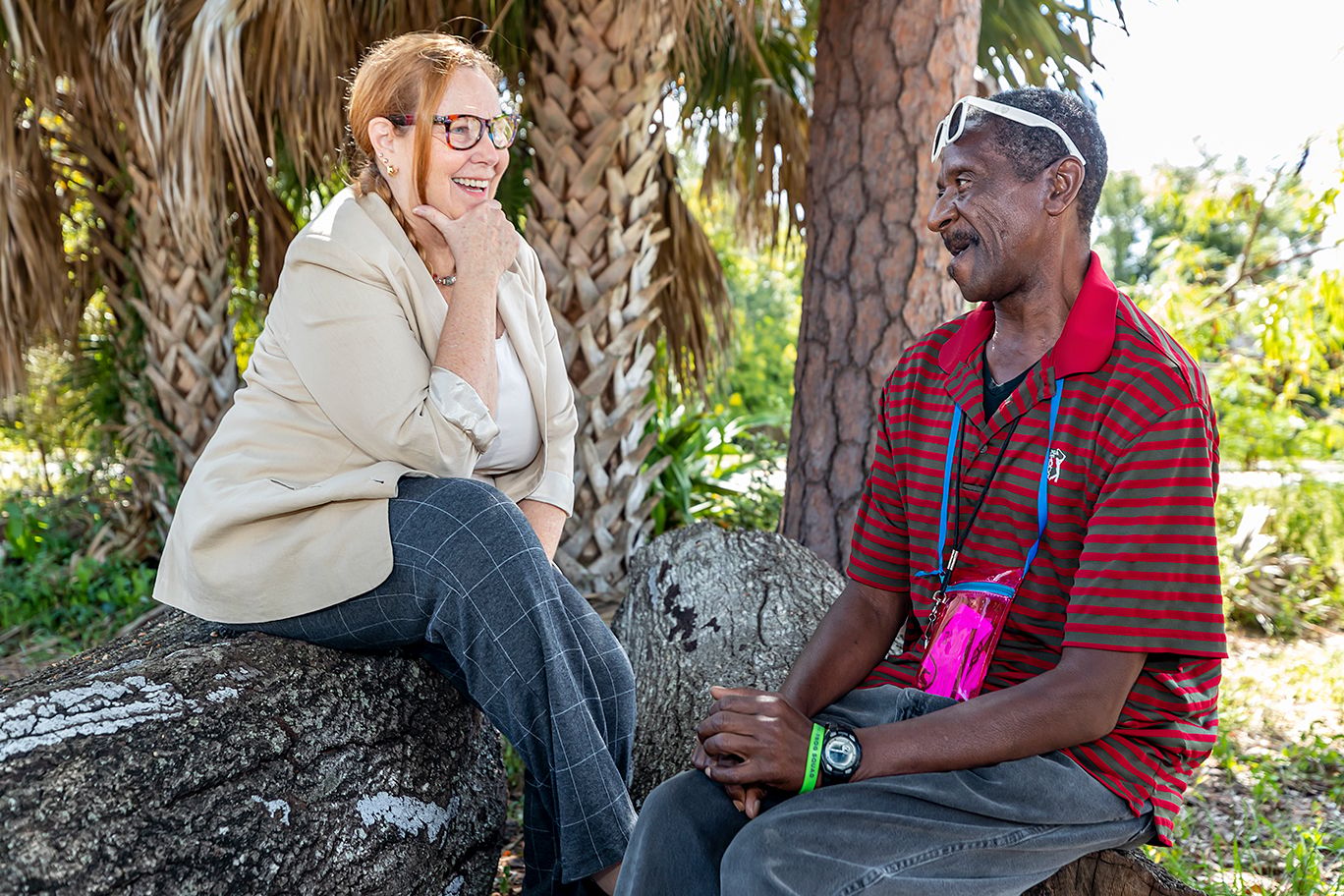 Residents engaged in a conversation outdoors