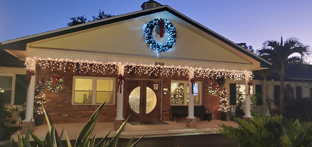 Holiday-decorated entrance of a senior living facility