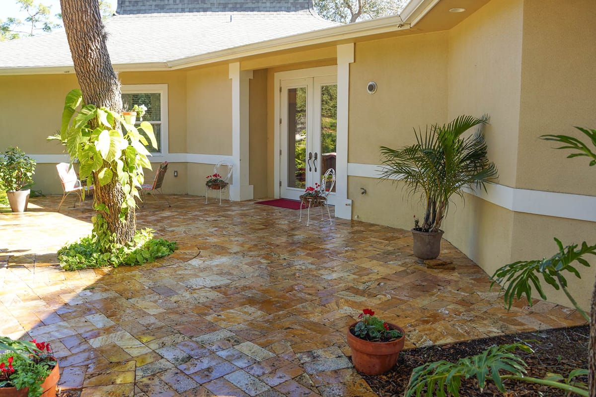 Outdoor patio area with seating and plants