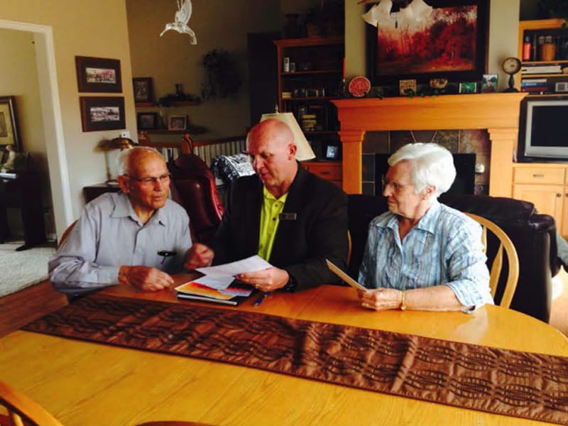 Sunshine Terrace Skilled Nursing, Nursing Home in Logan, UT — Meeting at a dining table among seniors and staff