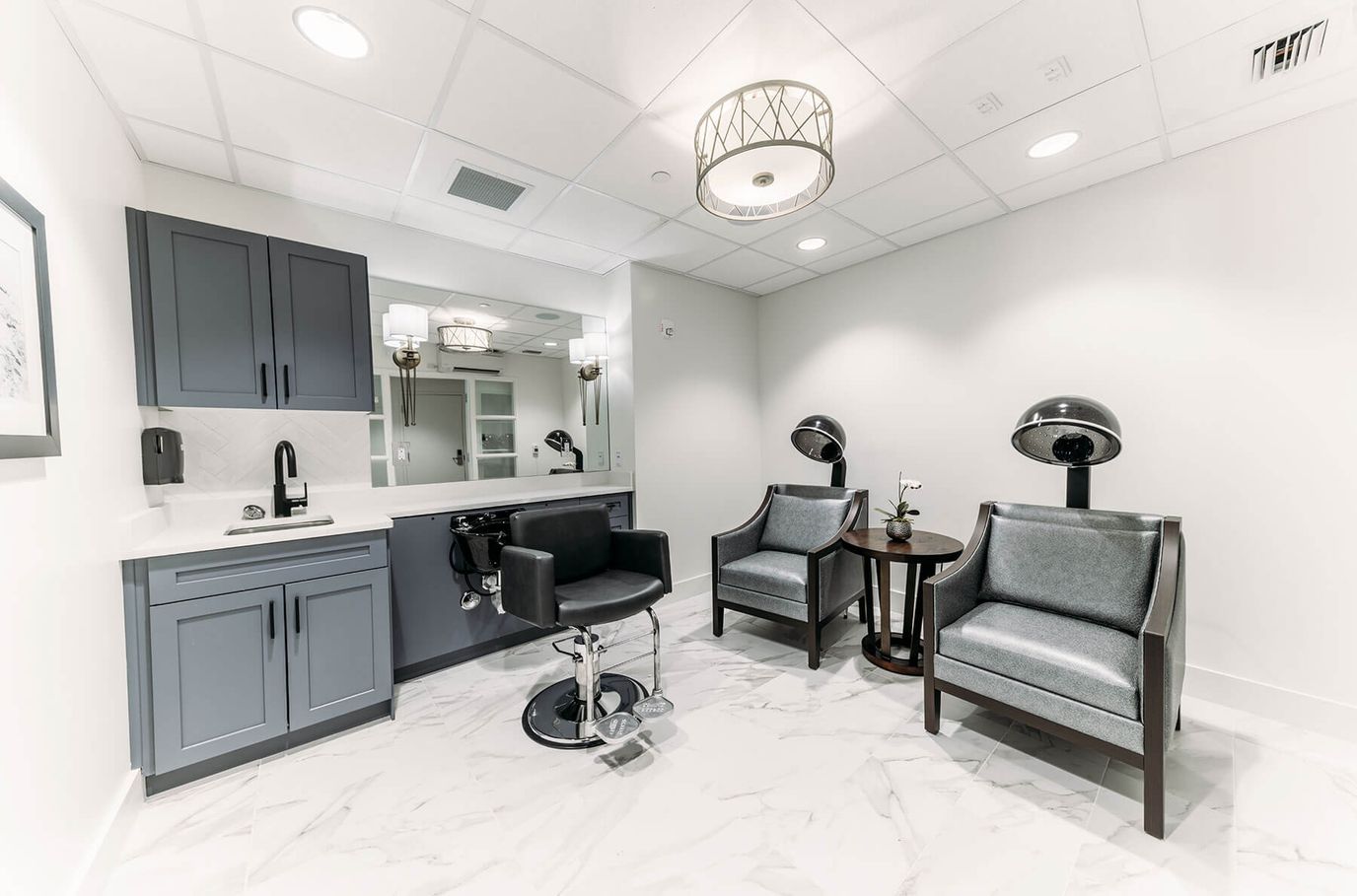 Interior beauty salon area with salon chairs and mirrors