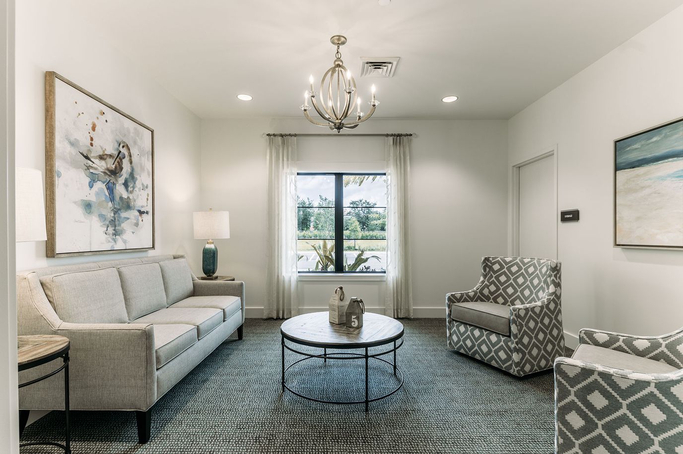 Bright interior common area with seating and artwork