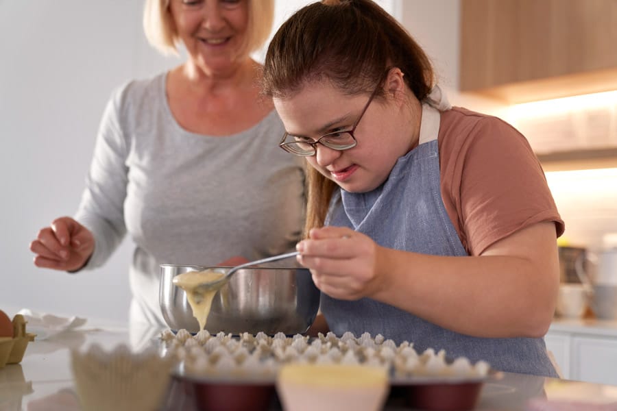 Residents baking together in a kitchen
