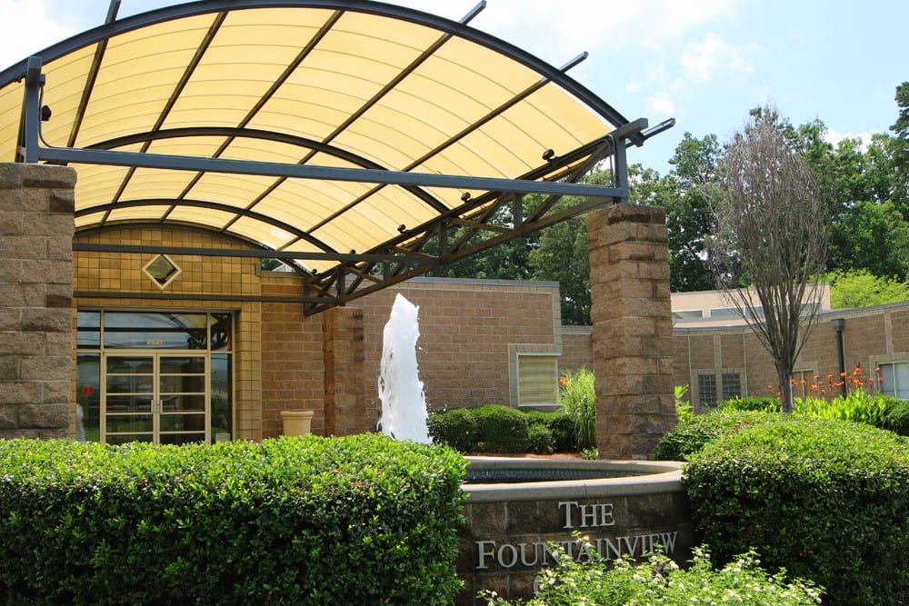 Exterior view of Fountainview Center entrance with water feature